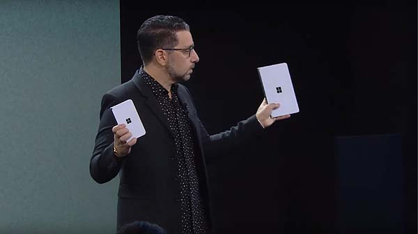 Microsoft Chief Product Officer Panos Panay holds up two of the devices announced at the October, 2019, Microsoft launch event in New York
