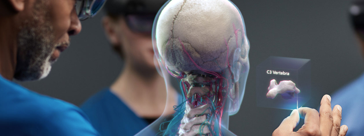 Surgeon and medical team, using HoloLens 2 to assist in an operating theatre