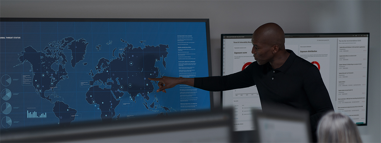 businessman points to a spot on a global map dashboard