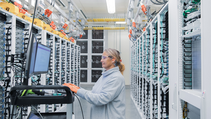 Researcher working at a terminal station in a data center