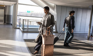 Image of an enterprise female in business travel at airport.