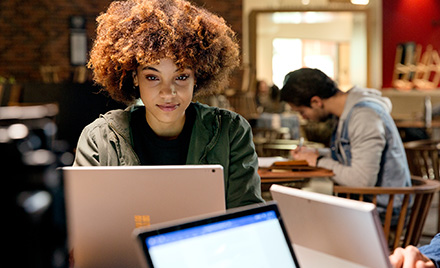 Image of an office worker working on her computer.