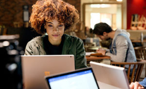 Image of an office worker working on her computer.