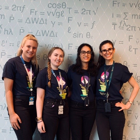 Photo of Holly and a group of three other young women at Microsofts DigiGirlz event