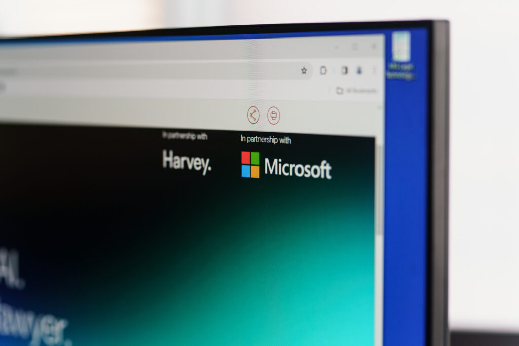 Close-up of the company's Harvey application interface showing a Microsoft Windows logo