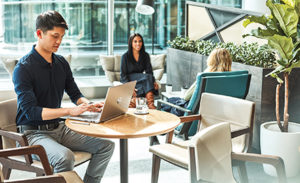 Image of a small worker gathering in a conference room.