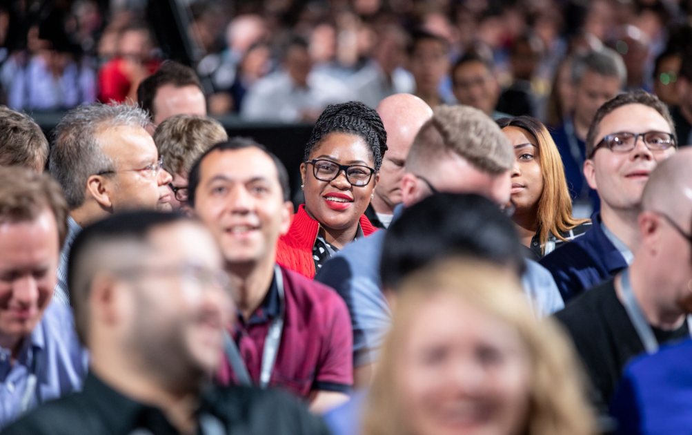 a group of people standing in front of a crowd