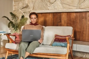 Woman interacting with an Asus laptop.