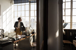 Photo of a female marketing professional in a bright office.