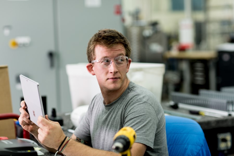 a man holding a laptop