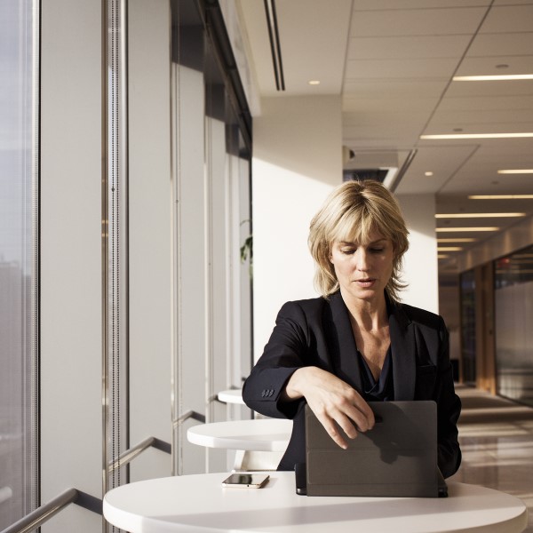 Businesswoman in remote office working on laptop