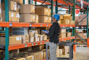 Man looking at inventory in a warehouse