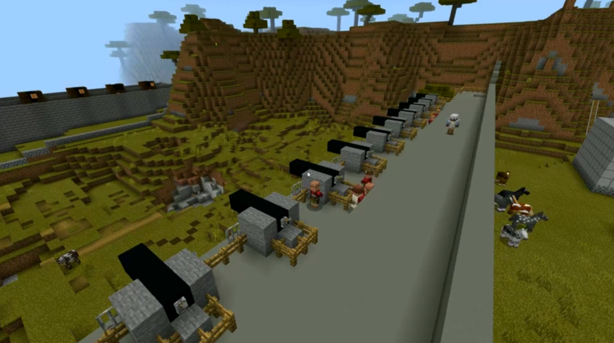 A line of cannons along a stone fortification in Minecraft: Education Edition