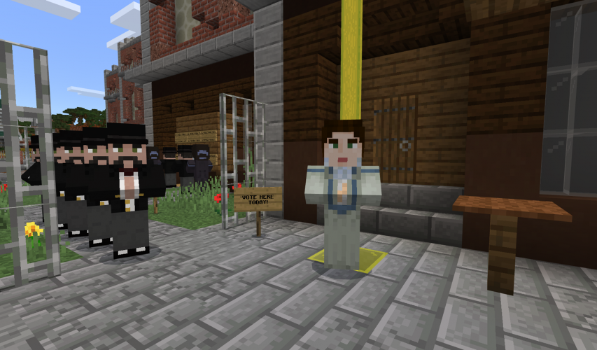 Emmeline Pankhurst stands near a voting line in Victorian England in Minecraft: Education Edition.