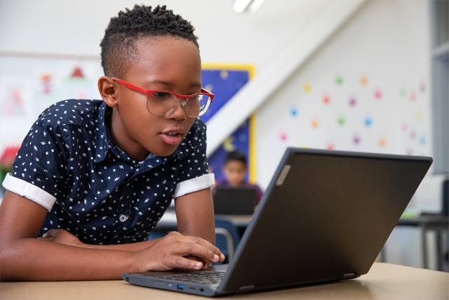 Student working on a laptop.