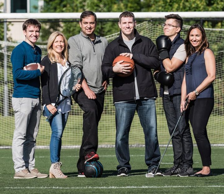 The Sports Performance Platform Garage project team is pictured on a soccer field at Microsoft campus; From left to right: Thomas Labuzienski, Susan Boyd, Rohit Puri, Steve Fox, Andrey Moor, Lisa Vailencour