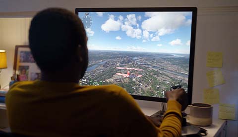 A man playing Microsoft Flight Simulator