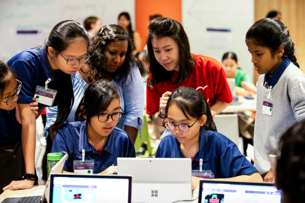 A group of girls learn programming basics at the DigiGirlz High Tech Camp in Singapore.