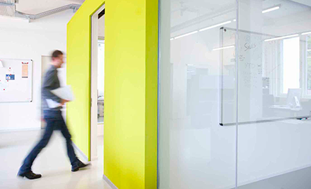 A worker walks into a meeting room at Accenture.