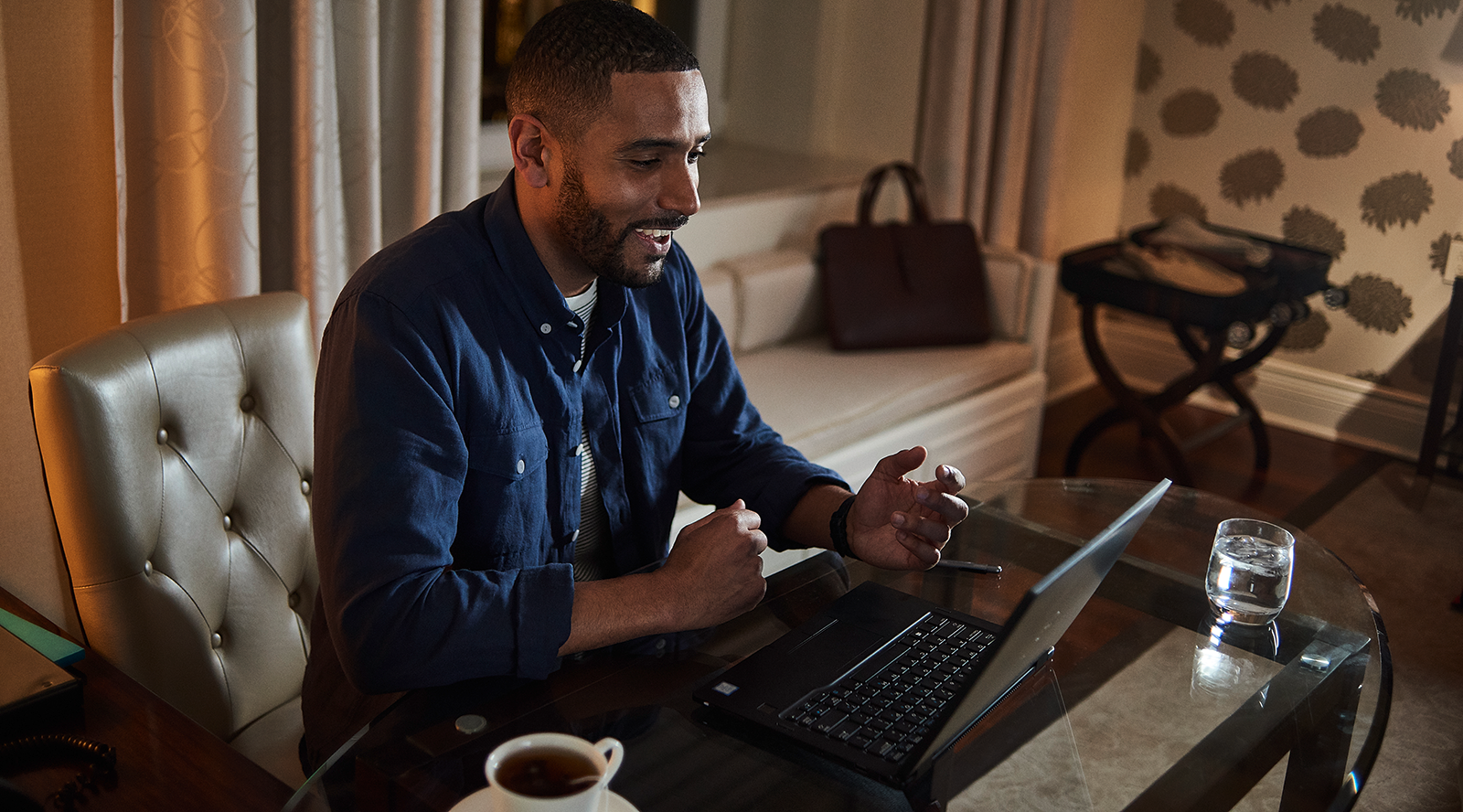 Office Desk with Laptop with Business Accessories and Cup of Tea