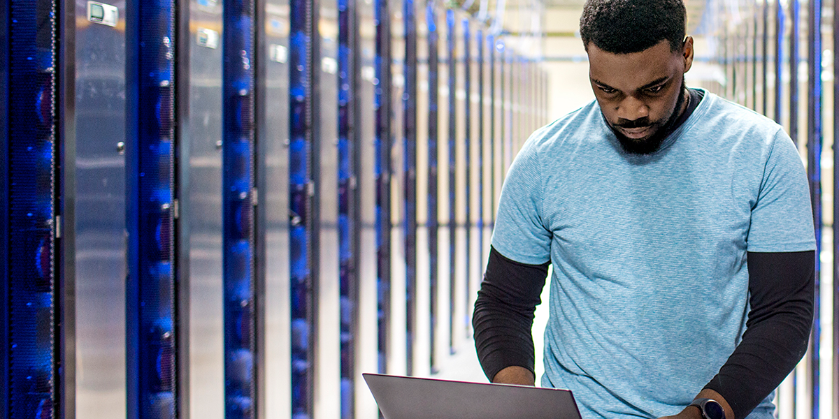 Image of an IT professional in a datacenter.