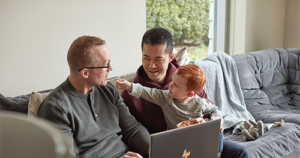 LGBTQ family with fathers and son using HP Spectre X360 15.