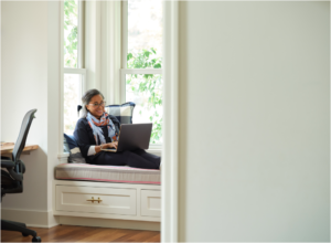 Woman working in a home office. Microsoft 365 Business Premium Female, home office, owner, collaboration, remote work (1)
