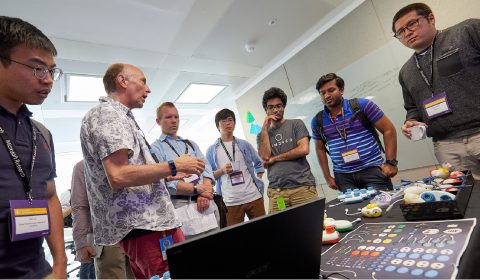 a group of people standing in a room