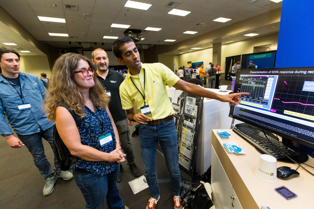Attendees check out a demonstration during Faculty Summit 2018.