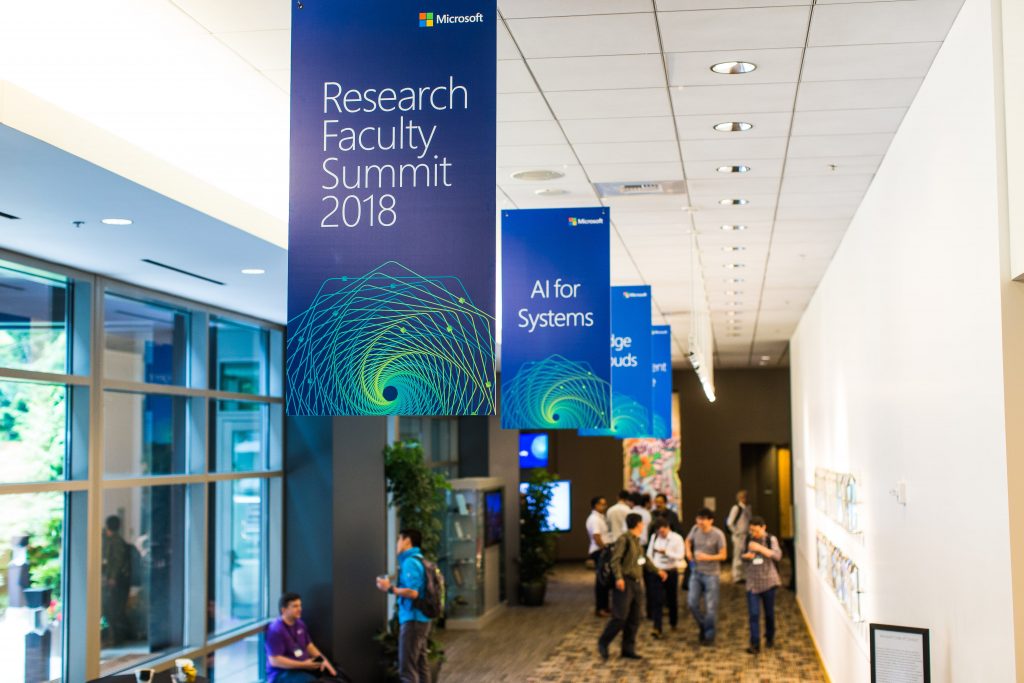 Attendees filing into a lecture room during Faculty Summit 2018.