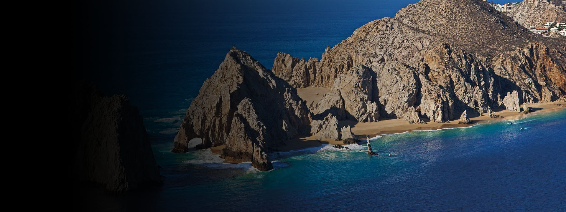 a rocky island in the middle of a body of water