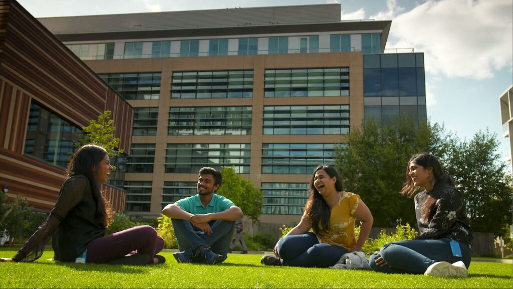 interns on the lawn of Microsoft Research Cambridge