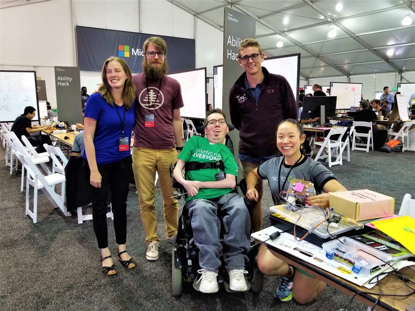 Photograph of five people at the hackathon event