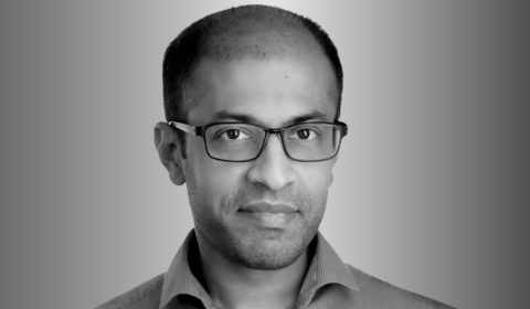 head shot of Dr. Siddhartha Sen for the Microsoft Research Podcast