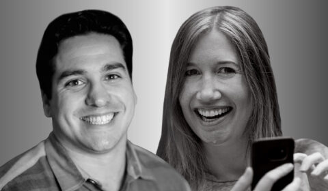 Two people side by side, Matt Brodsky on the left and Jaime Teevan on the right, in black and white smile and look forward. Teevan is holding a cell phone.