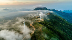 environmental sustainability - a windfarm on a cloudy mountaintop