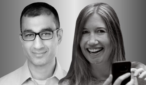 Portraits of Microsoft researchers Sid Suri and Jaime Teevan photographed in black and white. Both smile and look forward. Teevan, on the right, is holding a cell phone in the lower right of the frame.