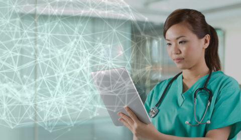 AI and the future of health - female doctor reviewing tablet