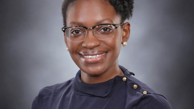 Chinasa T. Okolo glasses and smiling at the camera