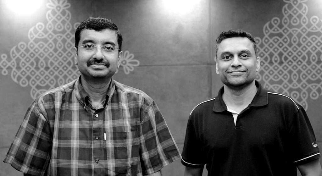 Black and white photo of Dr. Venkat Padmanabhan and Ajay Manchepalli