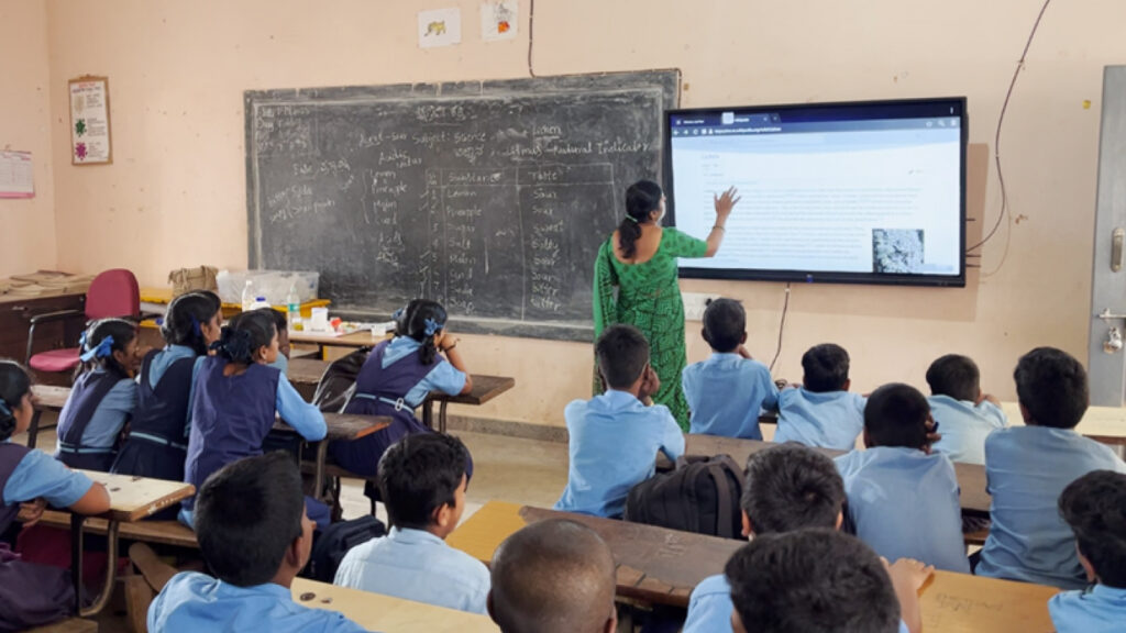 Project VeLLM - photo of a teacher and classroom full of students