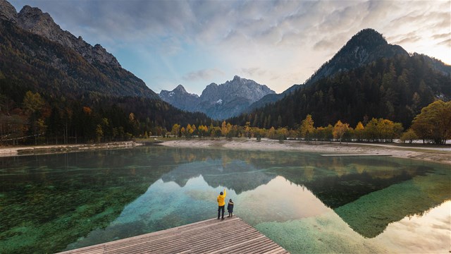 AI4Good - Sustainability | a body of water with a mountain in the background