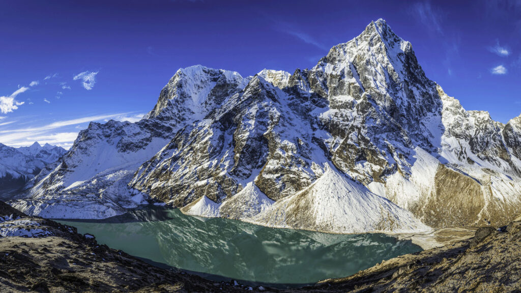 AI for Good - a view of a snow-covered mountain behind a glacial lake