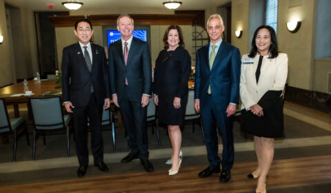 a man standing in front of Fumio Kishida, Brad Smith, Rahm Emanuel, Miki Tsusaka posing for the camera