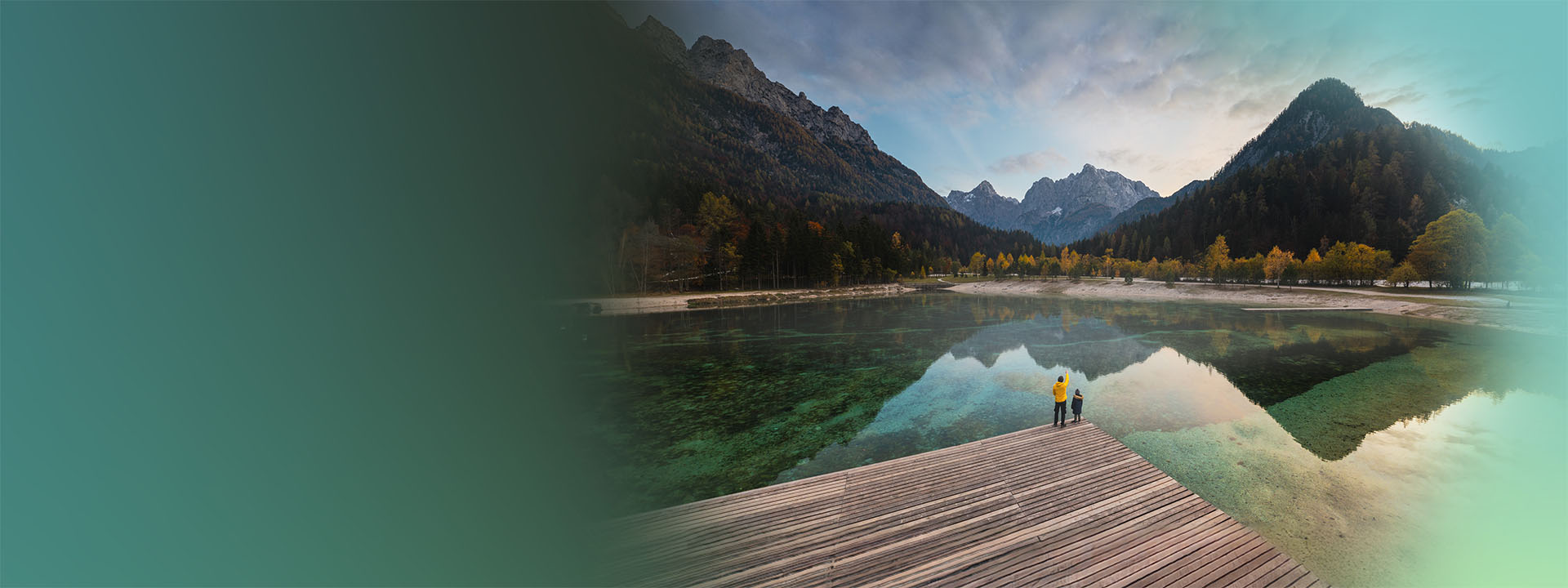 A body of water with a mountain in the background