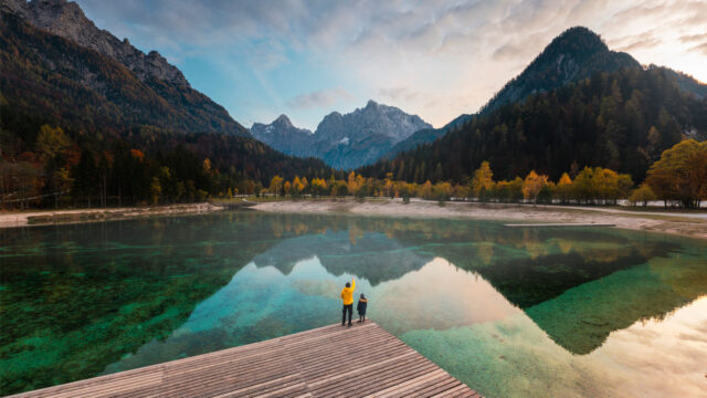 mountain backdrop person by lake