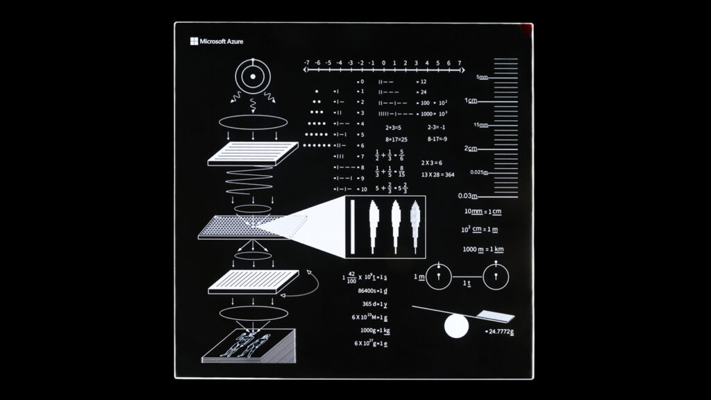 Another Project Silica glass platter without any data includes visible descriptions written inside the glass. The descriptions were put together by the Avenues team to explain to a finder the concepts needed to understand how to read the data on the other Project Silica glass platter.