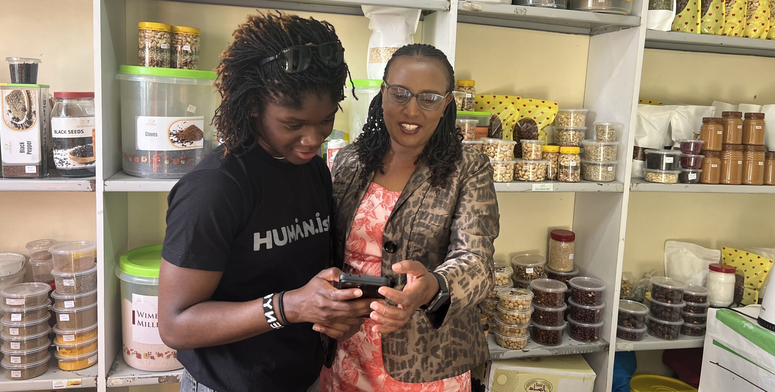 Researcher and small business user using Dukawalla app