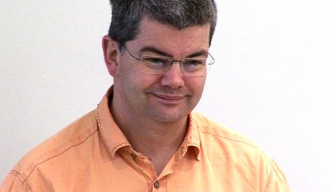 Andreas Zeller wearing glasses and smiling at the camera