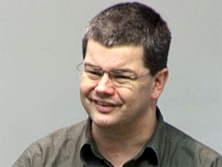 Andreas Zeller wearing glasses and smiling at the camera